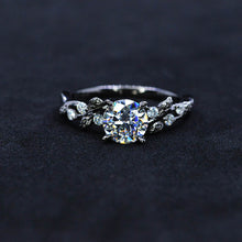 Load image into Gallery viewer, Round Brilliant Cut Moissanite Floral Black Gold Engagement Ring