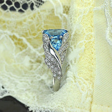 Load image into Gallery viewer, 3.0 Carat Blue Topaz 8x6mm Emerald Cut Center Stone and two Pear 6x4mm 2x0.5 Carat Wing Ring with 10K white Gold ring size 9