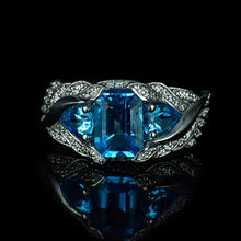Load image into Gallery viewer, 3.0 Carat Blue Topaz 8x6mm Emerald Cut Center Stone and two Pear 6x4mm 2x0.5 Carat Wing Ring with 10K white Gold ring size 9
