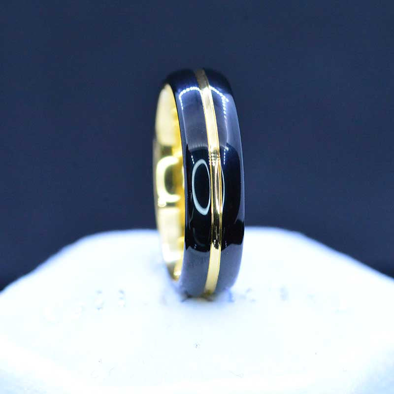 Mirror polished black tungsten band, with yellow gold color plated center strip  polished beveled edges.