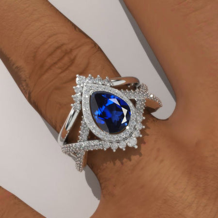 14K White Gold 1.5 Carat Pear Royal Blue Sapphire Halo Twisted Engagement Ring Eternity Ring Set