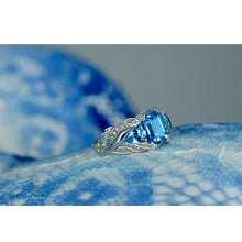 Load image into Gallery viewer, 3.0 Carat Blue Topaz 8x6mm Emerald Cut Center Stone and two Pear 6x4mm 2x0.5 Carat Wing Ring with 10K white Gold ring size 9
