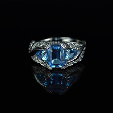 Load image into Gallery viewer, 3.0 Carat Blue Topaz 8x6mm Emerald Cut Center Stone and two Pear 6x4mm 2x0.5 Carat Wing Ring with 10K white Gold ring size 9
