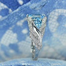 Load image into Gallery viewer, 3.0 Carat Blue Topaz 8x6mm Emerald Cut Center Stone and two Pear 6x4mm 2x0.5 Carat Wing Ring with 10K white Gold ring size 9
